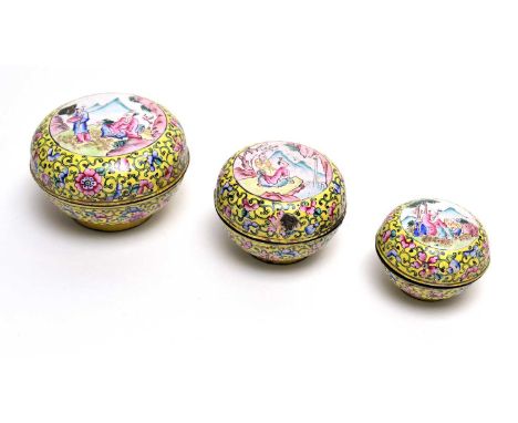 A set of three Canton enamel yellow ground graduated covered bowls, 19th Century, decorated in famille rose enamels with figu