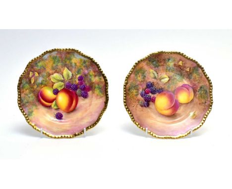 A pair of Royal Worcester fruit painted tea plates by Brain Leaman and Paul English, painted with peaches, blackberries and g