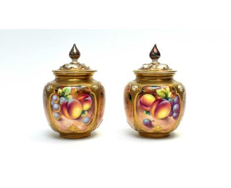 A pair of Royal Worcester fruit painted vases and covers by William Roberts, painted with peaches and grapes, signed Roberts,