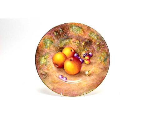 A Royal Worcester fruit painted dinner plate by Paul English, painted with apples, cherries and a gooseberry, gilt lined rim,