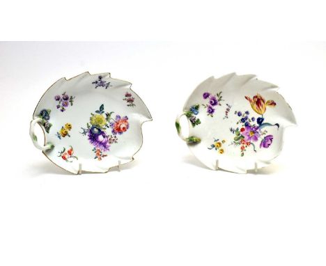 A Pair of Meissen leaf shaped dessert dishes, 19th century, each painted with 'Deutsche Blumen' within a basket moulded borde