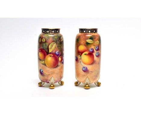A pair of Royal Worcester fruit painted vases by William Roberts and David Scyner, of slender ovoid form with gilt pierced ri