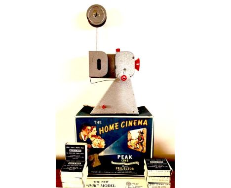 'THE HOME CINEMA' PEAK 16mm PROJECTOR PLUS SEVEN BLACK AND WHITE FILMS, HAND OPERATED

 