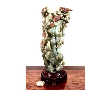LATE 20th CENTURY JADE CARVING OF A DOG AT BASE OF A TREE ENTWINED WITH VINE LEAVES AND ALIGHTED BUTTERFLIES, TESTED NEPHRITE