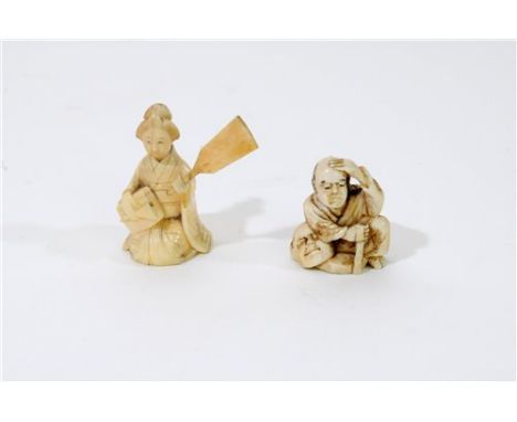 A Japanese carved ivory okimono of a man with a noh mask, Meiji period, he sits rubbing his forehead looking pained and with 