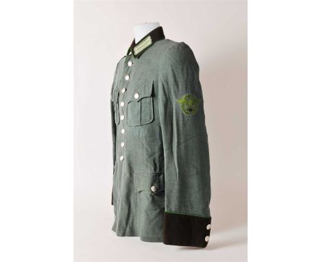 A German Third Reich Schutzpolizei NCO’s Summer Weight tunic (Sommerfahrrock für Kraftfahrbeamte) constructed of light-weight