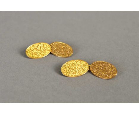 A pair of 18ct gold cufflinks, each of oval form with scrolling decoration, total weight approx 7.6g