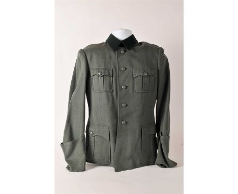 A German Third Reich Army tunic lacking any insignia constructed of field grey wool/rayon mix with four box pleated patch poc