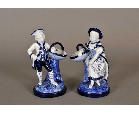 A pair of Royal Worcester blue and white figures third quarter of the 19th century, modelled as male and female in 18th centu