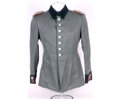 A German Third Reich M35 Parade tunic to an Oberintendanturrat the tunic in field grey with dark green collars and cuffs and 