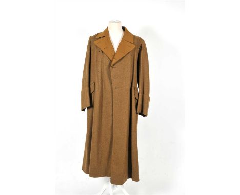A German Third Reich NSDAP Political Leader’s greatcoat and pair of breeches constructed of tan brown wool, with open collar 