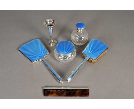 A collection of silver and blue guilloche enamel mounted dressing wares, comprising a perfume bottle, a circular jar and cove