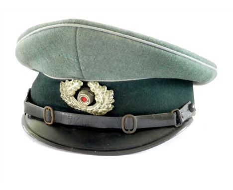 A Third Reich German Army EM/NCO visor cap - possibly Transportation Officer/Propaganda Officer constructed of green woollen 