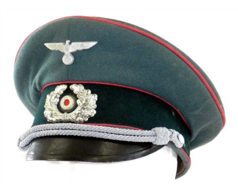 A German Third Reich Army Panzer Officer's visor cap a private purchase cap constructed of field grey short-napped wool with 