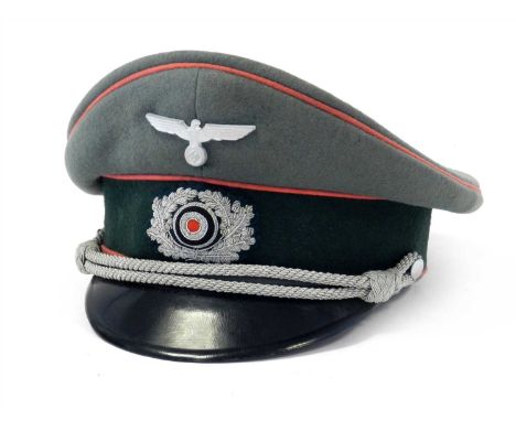 A German Third Reich Army Panzer Division (Tanks) Officer’s visor cap constructed of field grey doeskin with three rows of pi