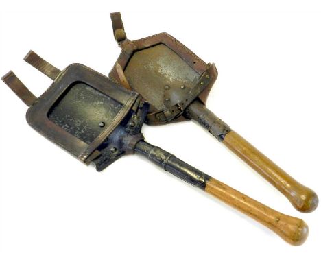 A German WWI entrenching tool (Klappspaten) the dark leather cradle stamped ‘S.A. ROEVER – MAGDEBURG/B’ and dated 1915 togeth