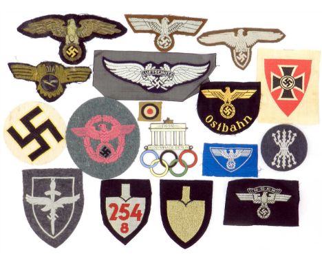 German Third Reich insignia including Tropical Army Officer and Government Service Official eagles; Ostbahn sleeve eagle; Luf