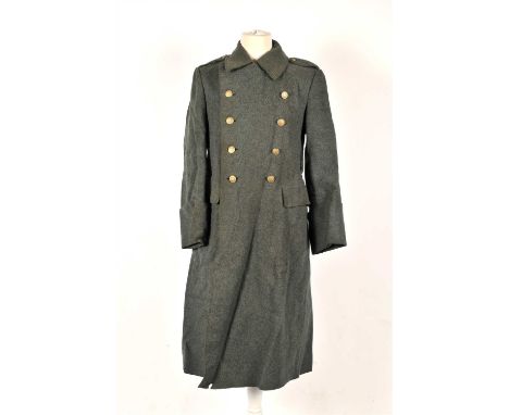A WW2 Swiss Army greatcoat constructed of green wool with double-breasted front closure secured by brass buttons with cross, 