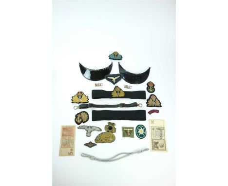 A small and varied selection of cloth insignia and cap materials including a West German edelweiss patch, British WW2 Navy bu