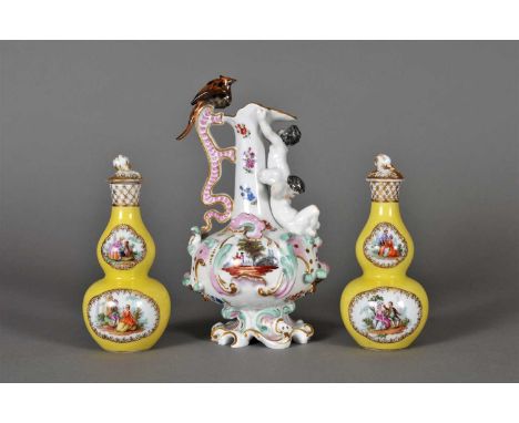 A pair of Continental porcelain ewer late 19th century, painted with two painted Antoine Watteau-esque panels surrounding rel