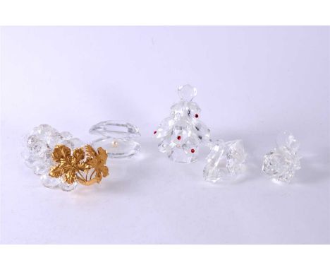 A group of Swarovski Crystal ornaments including a Christmas Tree; a rose; a swan, a clam with pearl and a bunch of grapes wi