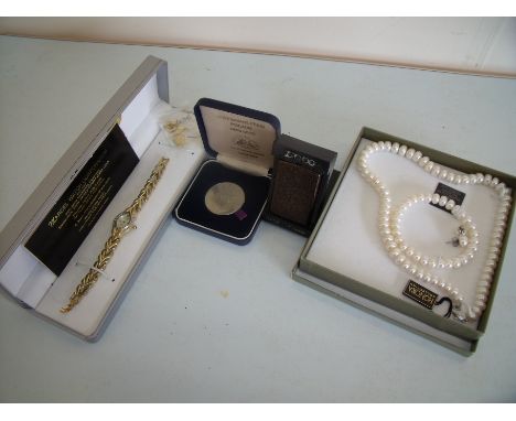 Cased cultured pearl necklace bracelet and earrings, a Metropolitan Police 150th Anniversary Commemorative medal, a Zippo lig