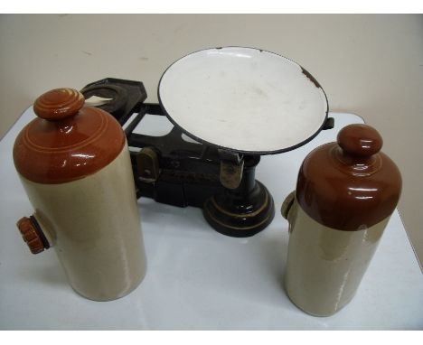 Pair of kitchen scales with enamel pan, two stoneware hot water bottles, a Victorian oil lamp, two gas lamps and a table lamp