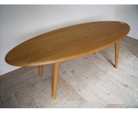 Modern elm Ercol style oval coffee table (110cm x 46cm x 37cm)