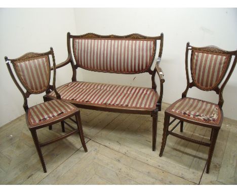 Late 19th C mahogany inlaid two seat sofa and a pair of matching armchairs in striped upholstery