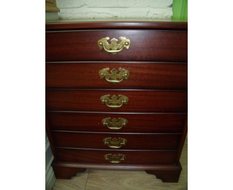 Small mahogany CD storage chest of three drawers in the form of six drawers on raised bracket feet (51cm x 40cm x 63cm)
