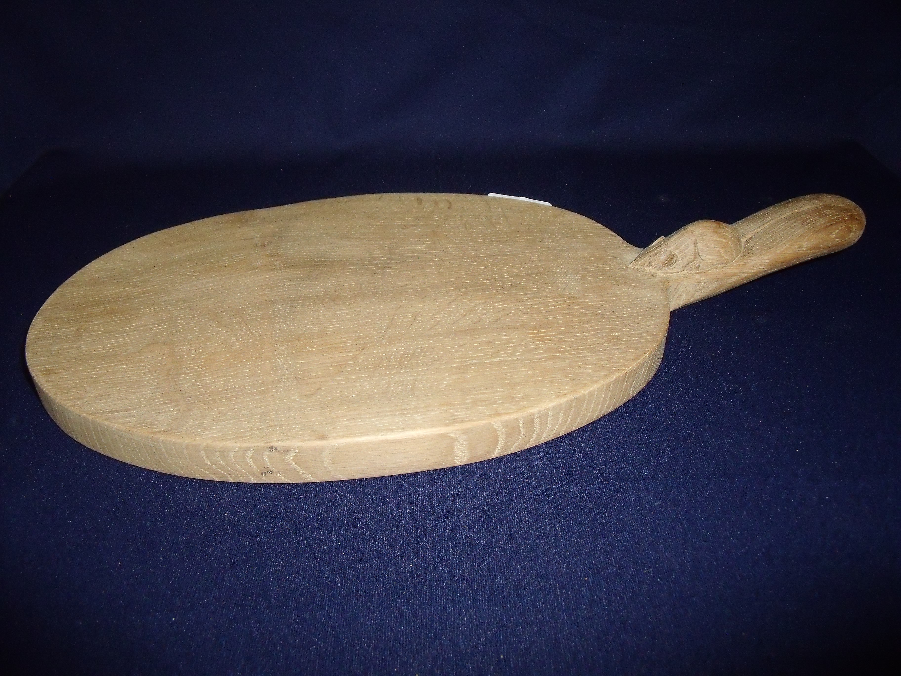 Carved oak Robert Thompson 'Mouseman' oval cheese board with raised