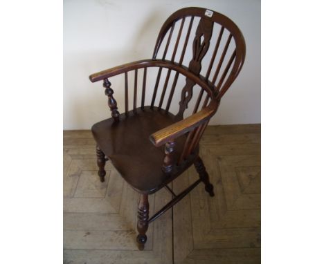 Elm stick back Windsor armchair with H shaped under stretcher and turned supports 