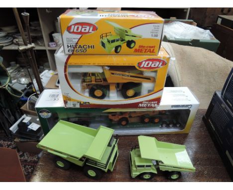 Four Joal diecast construction vehicles, two boxed and a Cararama 1/50 scale diecast low loader with tipper truck, boxed