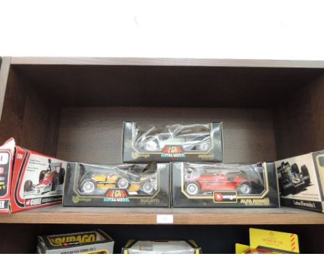 Three Burago 1/18 scale diecast vintage racing cars and two Corgi 1/18 scale diecast McLaren and Lotus F! Racing cars, all bo