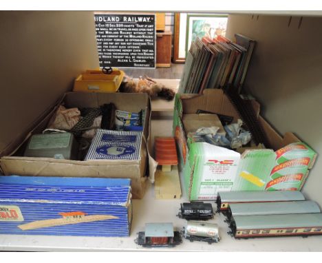 A shelf of Hornby Dublo and similar 00 gauge rolling stock and accessories including carriages, island platform boxed D1, lev