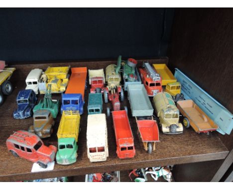 A selection of Dinky diecast vehicles including; a Foden eight wheel flatbed wagon, a Massey Harris Tractor, a Austin Taxi et