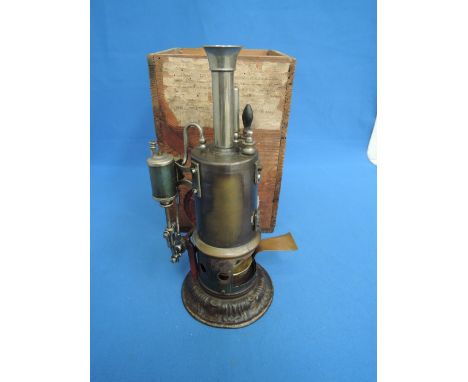 An early 20th century Schooner Vertical steam engine similar to 101/2 having wooden box with retail label for the Inventors m