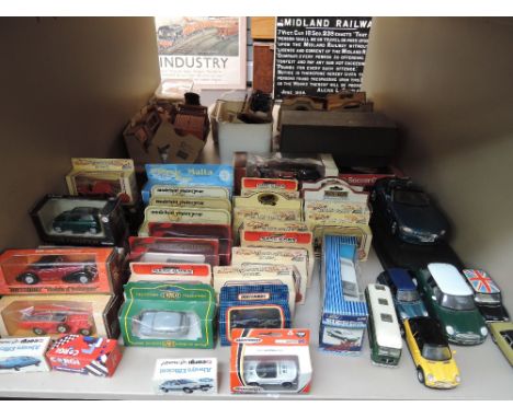 A shelf of mixed diecast vehicles including Matchbox, Days Gone By etc,  most boxed