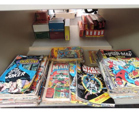 A shelf of late 20th Century Marvel, DC and similar comics including Spiderman, Superman, Star Wars etc