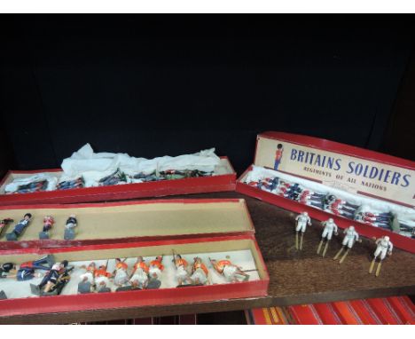 A shelf of Britain's and similar lead figures including military interest , with boxes 