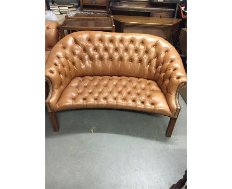 Brown button back leather sofa