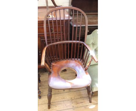 A Victorian comb back elbow chair converted to commode