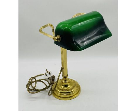 A vintage banker's lamp with green shade