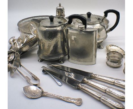 An assortment of silver plated item including cutlery, coffee pot, tea pots, napkin rings etc