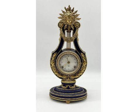 A cobalt blue and gilt Marie Antoinette 18th century style lyre mantle clock by Franklin Mint for the V &amp; A Museum 