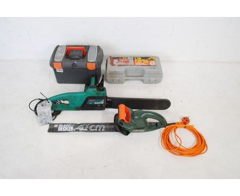A boxed Am-Tech 2 ton hydraulic floor jack along with a boxed Ryobi WS-512 circular saw with instructions, a Bosch 300B Ake 1