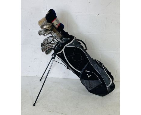 A set of Callaway "Big Bertha" right-handed golf clubs including Titanium Driver and woods 2,3 &amp; 7, irons 1 and 3 to 9 an