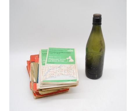 A Mitchell Toms &amp; Co of Chard glass bottle along with a collection of local ordnance survey maps - local interest