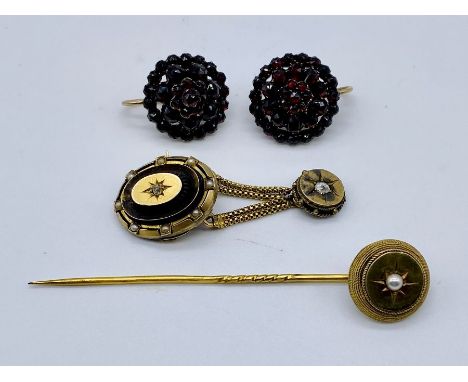 A small collection of Victorian gold jewellery including a stick pin, pair of garnet earrings etc.(all tested at 9-15ct)