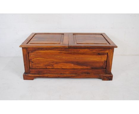 An Eastern wooden trunk with sliding top - length 110cm, depth 61cm, height 45cm